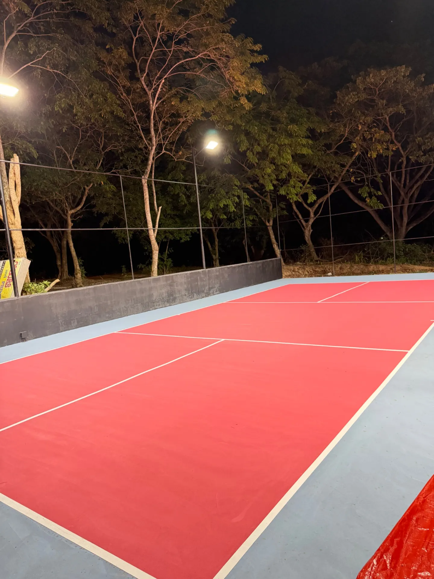 Court 1 at The Barn at night, lit by the floodlights