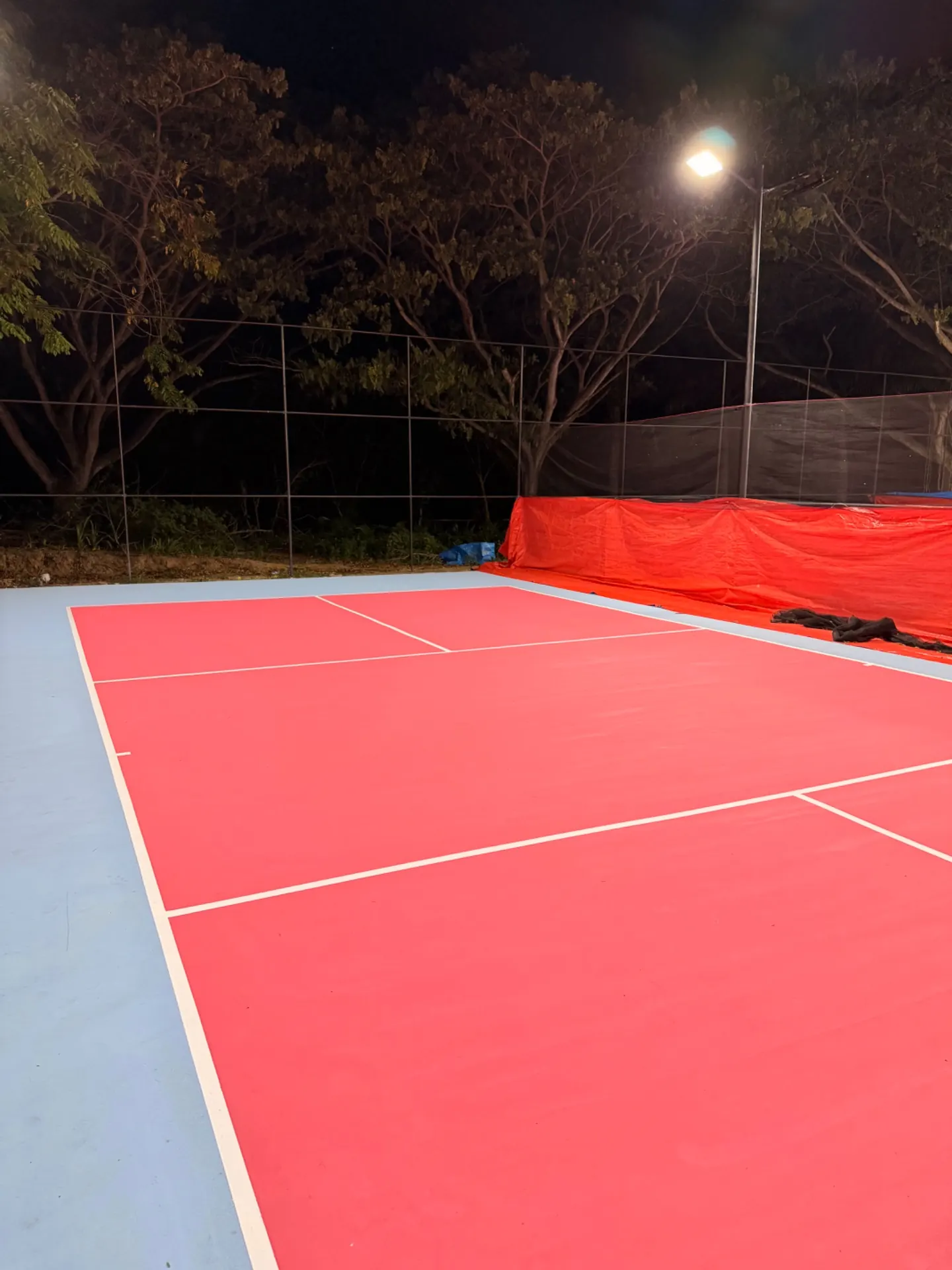 Court 2 at The Barn at night, lit by the floodlights